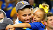 June 12, 2017; Oakland, CA, USA; Golden State Warriors guard Stephen Curry (30) celebrates with his daughter Riley Curry after beating the Cleveland Cavaliers in Game Five of the 2017 NBA Finals at Oracle Arena.