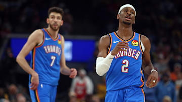 Apr 24, 2025; Memphis, Tennessee, USA; Oklahoma City Thunder guard Shai Gilgeous-Alexander (2) and forward Chet Holmgren (7) look on during the second quarter against the Memphis Grizzlies during game three for the first round of the 2024 NBA Playoffs at FedExForum. Mandatory Credit: Petre Thomas-Imagn Images
