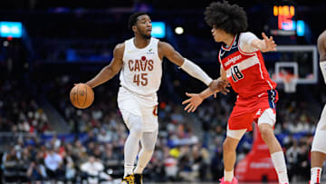 Feb 7, 2025; Washington, District of Columbia, USA; Cleveland Cavaliers guard Donovan Mitchell (45) handles the ball against Washington Wizards forward Kyshawn George (18) during the fourth quarter at Capital One Arena. Mandatory Credit: Reggie Hildred-Imagn Images