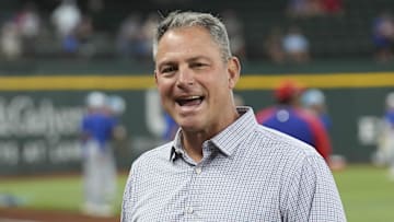 Jun 21, 2024; Arlington, Texas, USA; Texas Rangers general manager Chris Young (left) and Kansas City Royals general manager J.J. Picollo (right) talk before the game against the Kansas City Royals at Globe Life Field. Mandatory Credit: Jim Cowsert-Imagn Images
