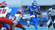 Kansas Jayhawks quarterback Jalon Daniels (6) runs for yards during the game between Fresno State and Kansas at David Booth Kansas Memorial Stadium.
