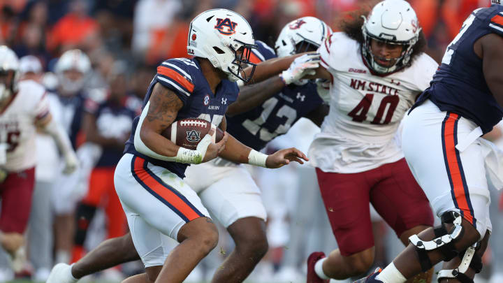 Nov 18, 2023; Auburn, Alabama, USA; Auburn Tigers running back Jarquez Hunter (27) carries the ball against the New Mexico State Aggies during the second quarter at Jordan-Hare Stadium. Mandatory Credit: John Reed-USA TODAY Sports