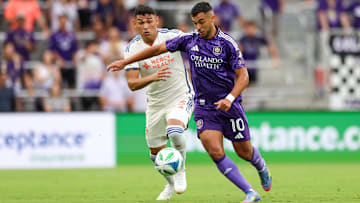 Jun 28, 2025; Orlando, Florida, USA; Orlando City midfielder Martin Ojeda (10) controls the ball from FC Cincinnati defender Gilberto Flores (3) in the first half at Inter&Co Stadium. Mandatory Credit: Nathan Ray Seebeck-Imagn Images