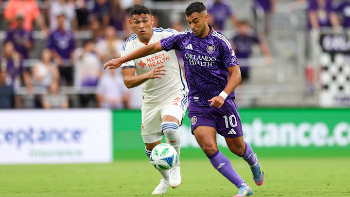 Jun 28, 2025; Orlando, Florida, USA; Orlando City midfielder Martin Ojeda (10) controls the ball from FC Cincinnati defender Gilberto Flores (3) in the first half at Inter&Co Stadium. Mandatory Credit: Nathan Ray Seebeck-Imagn Images