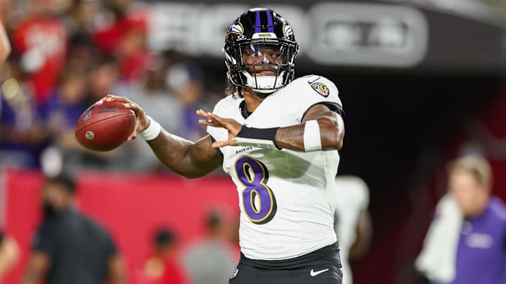 Baltimore Ravens quarterback Lamar Jackson (8) warms up before a game against the Tampa Bay Buccaneers at Raymond James Stadium. 