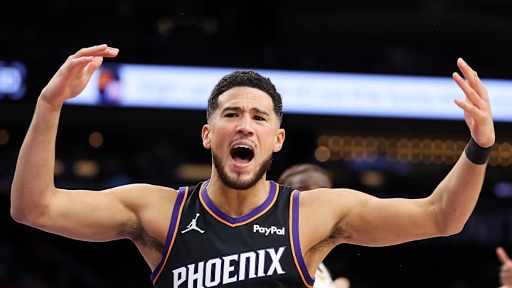 Phoenix Suns guard Devin Booker reacts to a call in a game against the Los Angeles Lakers.