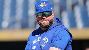 Jul 21, 2025; Toronto, Ontario, CAN; Toronto Blue Jays manager John Schneider (14) walks onto the field during practice before a game against the New York Yankees at Rogers Centre