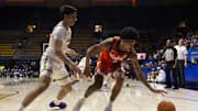 Jan 11, 2025; Berkeley, California, USA; Virginia Tech Hokies guard Rodney Brown Jr. (4) loses control of the ball against California Golden Bears guard Andrej Stojakovic (2) during the first half at Haas Pavilion. Mandatory Credit: D. Ross Cameron-Imagn Images