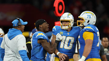 Sep 5, 2025; Justin Herbert (10) and Bradley Bozeman (75) celebrate after the game against the Kansas City Chiefs at Corinthians Arena