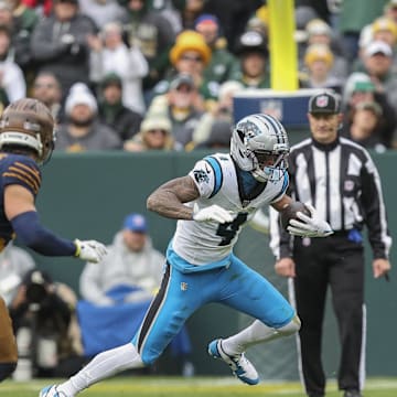 Nov 2, 2025; Green Bay, Wisconsin, USA; Carolina Panthers wide receiver Tetairoa McMillan (4) runs the ball after making a reception against the Green Bay Packers during the game at Lambeau Field. Mandatory Credit: Tork Mason-USA TODAY Network via Imagn Images