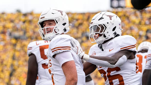 Texas quarterback Quinn Ewers (3) celebrates a touchdown against Michigan during the first half at Michigan Stadium in Ann Ar