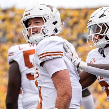 Texas quarterback Quinn Ewers (3) celebrates a touchdown against Michigan during the first half at Michigan Stadium in Ann Arbor on Saturday, September 7, 2024.