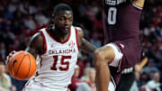Oklahoma Sooners guard Duke Miles (15) moves past Texas A&M Aggies guard Jace Carter (0) during an SEC men's college basketball game between the University of Oklahoma Sooners (OU) and the Texas A&M Aggies at Lloyd Noble Center in Norman, Okla., Wednesday, Jan. 8, 2025. Texas A&M won 80-78.