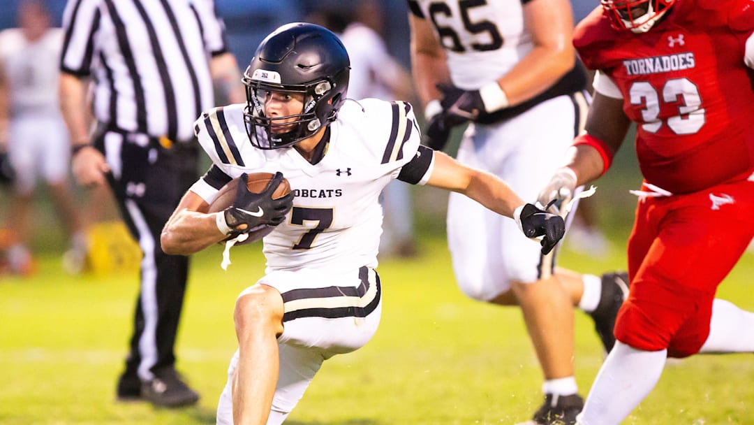 Buchholz Keil McGriff (7) runs for extra yards while playing Bradford. The Bradford Tornadoes played the Buchholz Bobcats in a Spring football game at Suwannee High School in Live Oak, FL on Thursday, May 16, 2024. Bradford defeated Suwannee 20-3 in the first half of action while Buchholz defeated Bradford 7-6 in their half of action. [Doug Engle/Gainesville Sun]