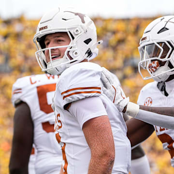 Texas quarterback Quinn Ewers (3) celebrates a touchdown against Michigan during the first half at Michigan Stadium in Ann Arbor on Saturday, September 7, 2024.