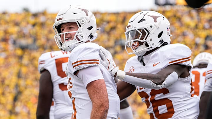 Texas quarterback Quinn Ewers (3) celebrates a touchdown against Michigan during the first half at Michigan Stadium in Ann Arbor on Saturday, September 7, 2024.