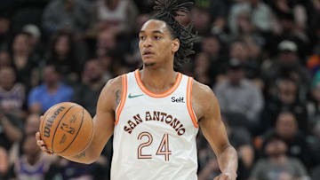 Mar 25, 2024; San Antonio, Texas, USA;  San Antonio Spurs guard Devin Vassell (24) dribbles in the first half against the Phoenix Suns at Frost Bank Center. Mandatory Credit: Daniel Dunn-Imagn Images