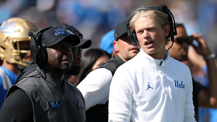 Oct 4, 2025; Pasadena, California, USA;  UCLA Bruins interim head coach Tim Skipper (left) and  new offensive coordinator Jerry Neuheisel (right) on the sideline during second half against the Penn State Nittany Lions at Rose Bowl. Mandatory Credit: Kiyoshi Mio-Imagn Images
