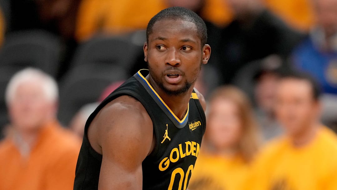 May 12, 2025; San Francisco, California, USA; Golden State Warriors forward Jonathan Kuminga (00) holds onto the ball against the Minnesota Timberwolves in the fourth quarter during game four of the second round for the 2025 NBA Playoffs at Chase Center. Mandatory Credit: Cary Edmondson-Imagn Images