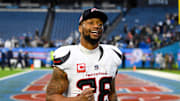 Jan 5, 2025; Nashville, Tennessee, USA;  Houston Texans running back Joe Mixon (28) smiles as he leaves the field against the Tennessee Titans during the second half at Nissan Stadium. Mandatory Credit: Steve Roberts-Imagn Images