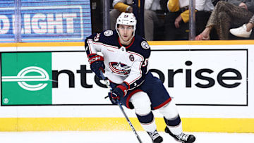Oct 26, 2024; Nashville, Tennessee, USA; Columbus Blue Jackets right wing Yegor Chinakhov (59) brings the puck around the board in the second period against the Nashville Predators at Bridgestone Arena. Mandatory Credit: Casey Gower-Imagn Images