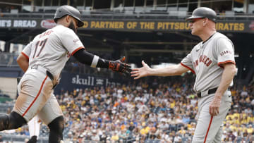 May 23, 2024; Pittsburgh, Pennsylvania, USA; San Francisco Giants third base coach Matt Williams (right) congratulates left fielder Heliot Ramos (17) heading to home plate on a solo home run against the Pittsburgh Pirates during the seventh inning at PNC Park.