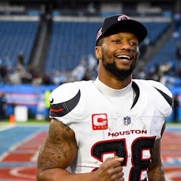 Jan 5, 2025; Nashville, Tennessee, USA;  Houston Texans running back Joe Mixon (28) smiles as he leaves the field against the Tennessee Titans during the second half at Nissan Stadium. Mandatory Credit: Steve Roberts-Imagn Images