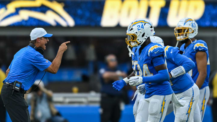 Aug 10, 2024; Inglewood, California, USA; Los Angeles Chargers head coach Jim Harbaugh reacts with the team after scoring a touchdown against the Seattle Seahawks during the third quarter at SoFi Stadium. Mandatory Credit: Jonathan Hui-USA TODAY Sports