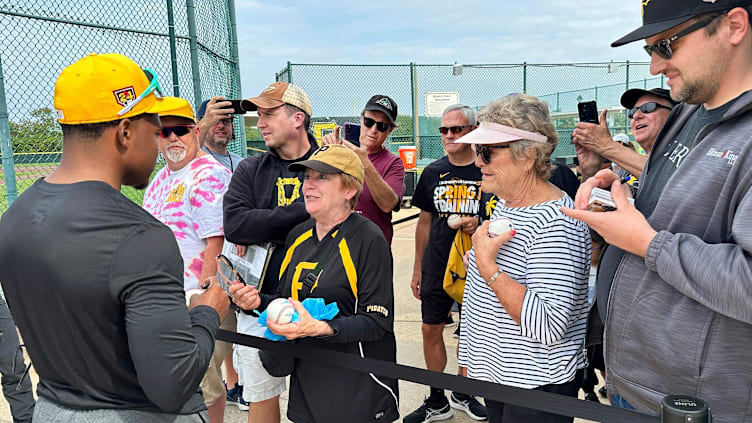 Infielder Termarr Johnson signs autographs and talks to fans gathered to watch the Pittsburgh