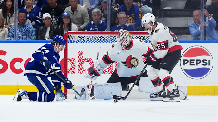 Apr 29, 2025; Toronto, Ontario, CAN; Toronto Maple Leafs center Bobby McMann (74) battles for the puck with Ottawa Senators defenseman Jake Sanderson (85) in the second period during game five of the first round of the 2025 Stanley Cup Playoffs at Scotiabank Arena. Mandatory Credit: Nick Turchiaro-Imagn Images Apr 29, 2025; Toronto, Ontario, CAN; Toronto Maple Leafs center Bobby McMann (74) battles for the puck with Ottawa Senators defenseman Jake Sanderson (85) in the second period during game five of the first round of the 2025 Stanley Cup Playoffs at Scotiabank Arena. Mandatory Credit: Nick Turchiaro-Imagn Images