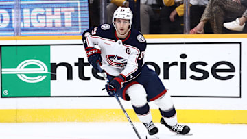 Oct 26, 2024; Nashville, Tennessee, USA; Columbus Blue Jackets right wing Yegor Chinakhov (59) brings the puck around the board in the second period against the Nashville Predators at Bridgestone Arena. Mandatory Credit: Casey Gower-Imagn Images