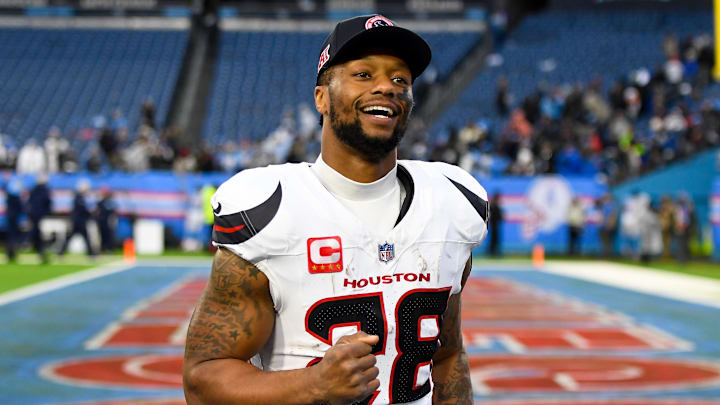Jan 5, 2025; Nashville, Tennessee, USA;  Houston Texans running back Joe Mixon (28) smiles as he leaves the field against the Tennessee Titans during the second half at Nissan Stadium. Mandatory Credit: Steve Roberts-Imagn Images