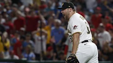 Jul 29, 2023; Pittsburgh, Pennsylvania, USA;  Pittsburgh Pirates relief pitcher David Bednar (51) reacts after the final out against the Philadelphia Phillies during the ninth inning at PNC Park. Pittsburgh won 7-6. Mandatory Credit: Charles LeClaire-Imagn Images