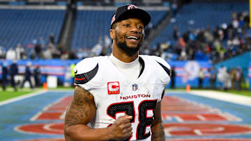 Jan 5, 2025; Nashville, Tennessee, USA;  Houston Texans running back Joe Mixon (28) smiles as he leaves the field against the Tennessee Titans during the second half at Nissan Stadium. Mandatory Credit: Steve Roberts-Imagn Images