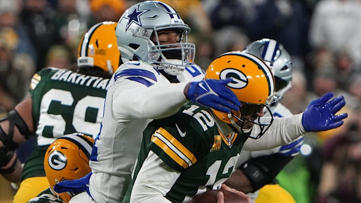 Dallas Cowboys defensive end Sam Williams sacks Green Bay Packers quarterback Aaron Rodgers. Dallas Cowboys defensive end Sam Williams sacks Green Bay Packers quarterback Aaron Rodgers.
