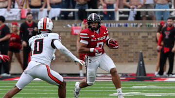 Sep 13, 2025; Lubbock, Texas, USA;  Texas Tech Red Raiders running back Cameron Dickey (8) rushes against Oregon State Beavers defensive back Kobe Singleton (0) in the first half at Jones AT&T Stadium. Mandatory Credit: Michael C. Johnson-Imagn Images