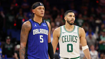 Orlando Magic forward Paolo Banchero (5) and Boston Celtics forward Jayson Tatum (0) wait for a break in play in the fourth quarter during game four of first round for the 2025 NBA Playoffs at Kia Center.