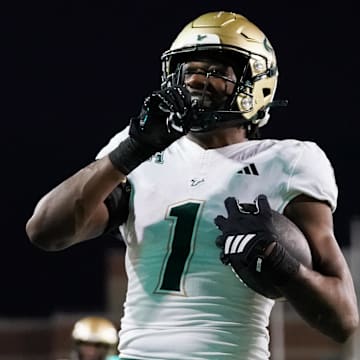 South Florida scored a whopping 63 points to silence the rowdy North Texas home crowd on Friday night.