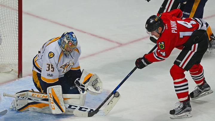 Jan 8, 2017; Chicago, IL, USA; Nashville Predators goalie Pekka Rinne (35) makes a save on a shot from Chicago Blackhawks left wing Richard Panik (14) during the third period at the United Center. Chicago won 5-2. Mandatory Credit: Dennis Wierzbicki-USA TODAY Sports Jan 8, 2017; Chicago, IL, USA; Nashville Predators goalie Pekka Rinne (35) makes a save on a shot from Chicago Blackhawks left wing Richard Panik (14) during the third period at the United Center. Chicago won 5-2. Mandatory Credit: Dennis Wierzbicki-USA TODAY Sports