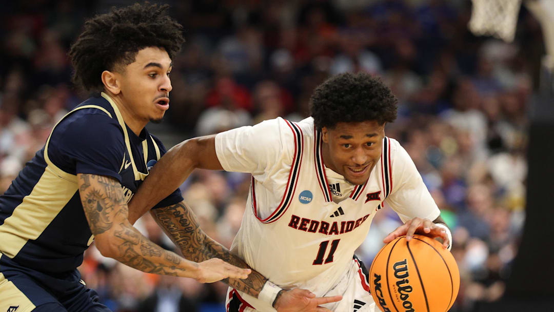 Texas Tech Red Raiders guard Jaylen Petty (11) drives against Akron Zips guard Sharron Young (3) in the second half during a first round game of the men's 2026 NCAA Tournament at Benchmark International Arena.