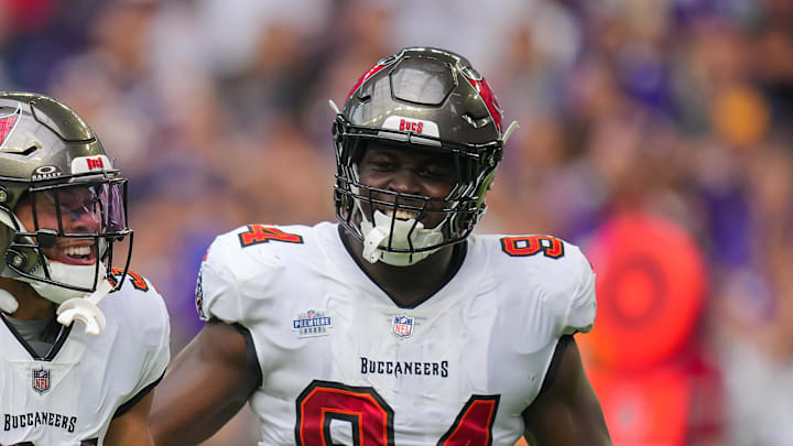 Sep 10, 2023; Minneapolis, Minnesota, USA; Tampa Bay Buccaneers safety Antoine Winfield Jr. (31) celebrates his fumble recovery with defensive tackle Calijah Kancey (94) against the Minnesota Vikings in the first quarter at U.S. Bank Stadium. Mandatory Credit: Brad Rempel-Imagn Images