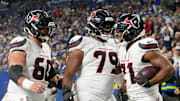 Houston Texans running back Nick Chubb (21) celebrates after rushing for a touchdown Sunday, Nov. 30, 2025, during a game against the Indianapolis Colts at Lucas Oil Stadium in Indianapolis.