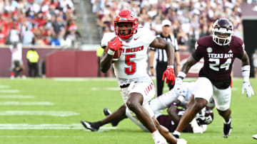 Sep 2, 2023; College Station, Texas, USA; New Mexico Lobos running back Jacory Croskey-Merritt (5) runs the ball during the first half against the Texas A&M Aggies at Kyle Field. Mandatory Credit: Maria Lysaker-USA TODAY Sports