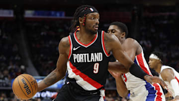 Nov 1, 2023; Detroit, Michigan, USA;  Portland Trail Blazers forward Jerami Grant (9) dribbles on Detroit Pistons guard Jaden Ivey (23) in the first half at Little Caesars Arena. Mandatory Credit: Rick Osentoski-Imagn Images