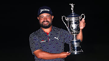 J.J. Spaun poses with the winner's trophy following his victory at the 2025 U.S. Open at Oakmont Country Club