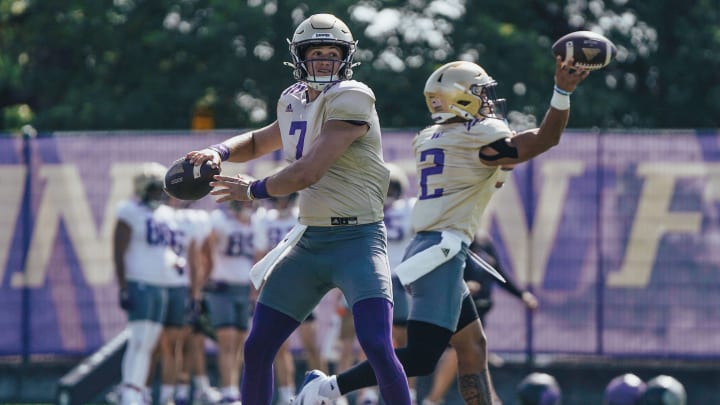 Will Rogers and Demond Williams Jr. throw at the same time in UW practice.