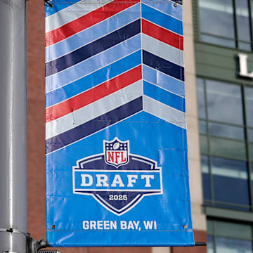 A banner advertising the 2025 NFL Draft hangs outside Lambeau Field.