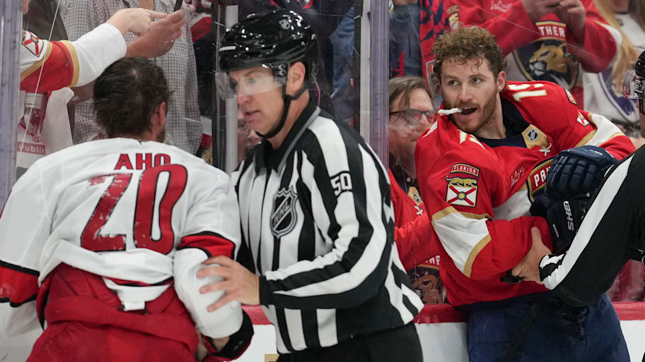 Carolina Hurricanes forward Sebastian Aho and Florida Panthers forward Matthew Tkachuk are separated by a referee during Game 3 of the Eastern Conference finals.  | Peter Joneleit/Icon Sportswire via Getty Images