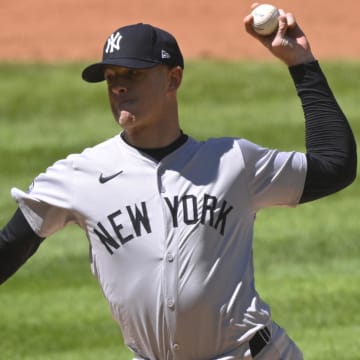 Apr 13, 2024; Cleveland, Ohio, USA; New York Yankees pitcher Caleb Ferguson (64) delivers a pitch in the the sixth inning against the Cleveland Guardians at Progressive Field. 