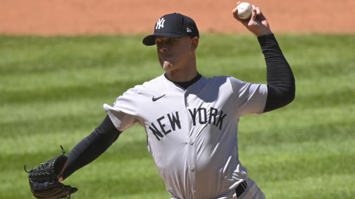 Apr 13, 2024; Cleveland, Ohio, USA; New York Yankees pitcher Caleb Ferguson (64) delivers a pitch in the the sixth inning against the Cleveland Guardians at Progressive Field. 